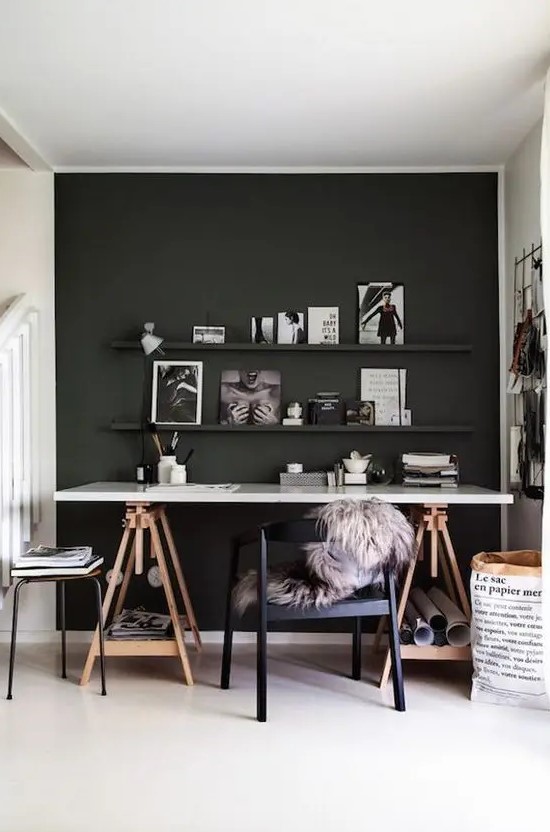 a Scandi space with a black statement wall and ledges, a trestle desk is a comfy solution
