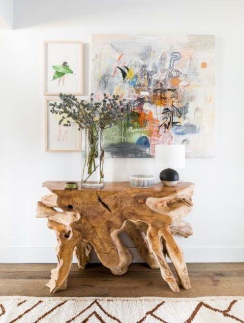 a console table of driftwood for a beach or seaside home entryway is a chic piece with a natural touch