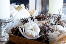 a dough bowl with pinecones, antlers, white pumpkins and acorns for fall home decor