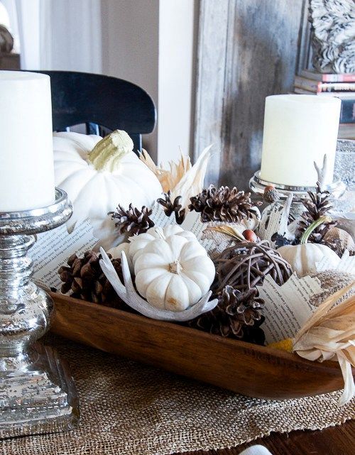 a dough bowl with pinecones, antlers, white pumpkins and acorns for fall home decor