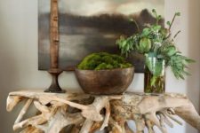 an interesting beachy driftwood console table