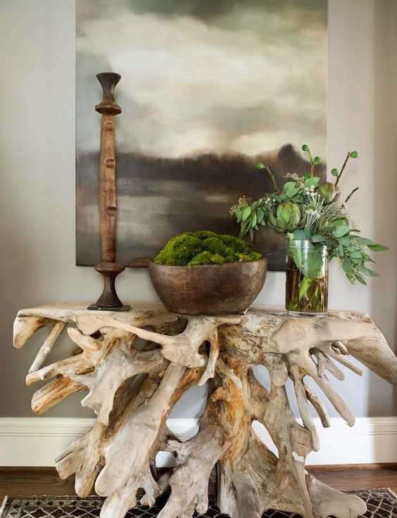 a driftwood console table is a budget-friendly piece that will bring an ocean feel to the space