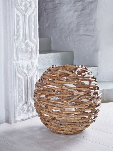 a large driftwood hurricane covered is a nice decor solution for any beach house