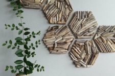 a modern wall art of driftwood hexagons is a very stylish and bold solution
