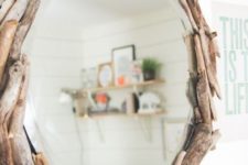 a round driftwood mirror is a cool idea to add a slight beachy feel to the space