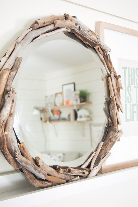 a round driftwood mirror is a cool idea to add a slight beachy feel to the space