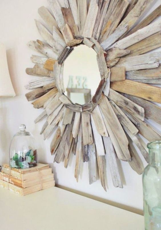 a small sunbrust mirror with lots of driftwood is a simple and very cute DIY
