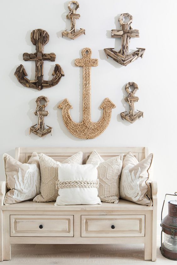 entryway decor of anchors made of driftwood and rope over the bench for a breezy beachy feel