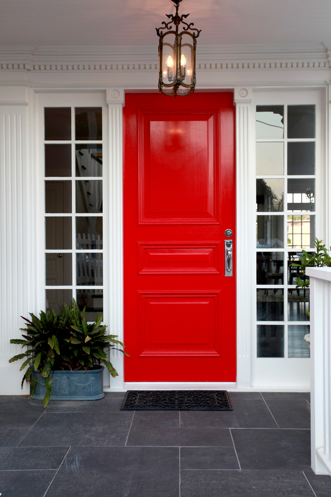 bright red door is perfect for minimalist yet cool front porch design (Michelle Marsden Design)
