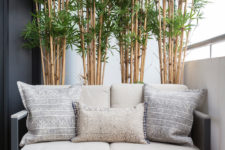 A small sofa, a coffee table and a bamboo wall would make a balcony a perfect place for an afternoon tea. (<a href="http://www.zulufish.co.uk">Zulufish</a>)