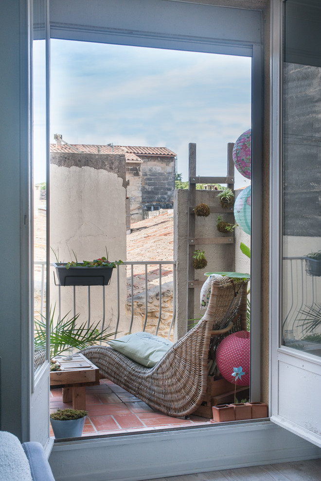 A comfy lounge chair is the best addition to a small balcony so you could relax there. Hanging planters is the best way to add some greenery there without occupying much space. (<a href="http://www.parenthesegrandjour.com">Jours & Nuits</a>)