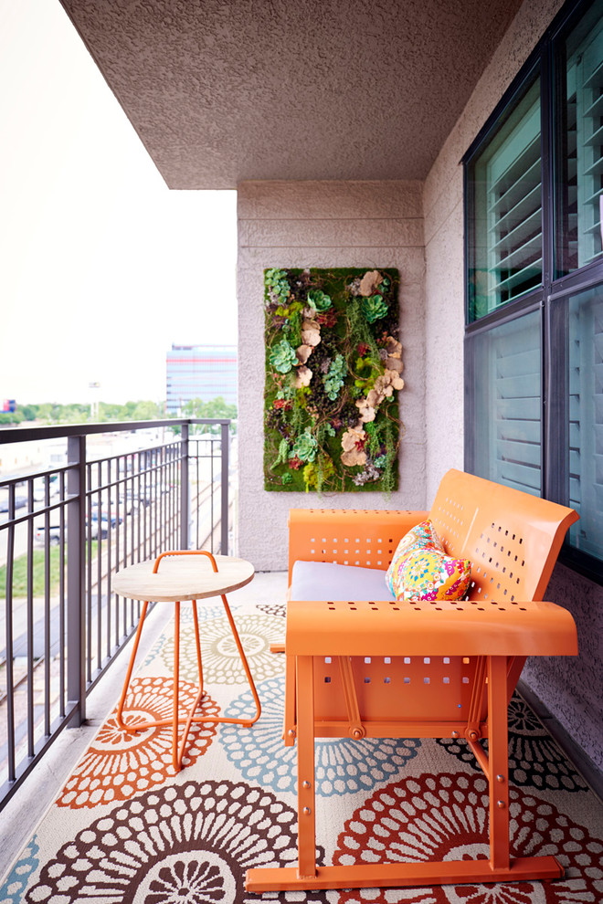 A rug can help yo make your balcony appear roomier and with the right print it could create the illusion of bigger space. A living wall is a perfect way to get a small garden without occupying any floor space