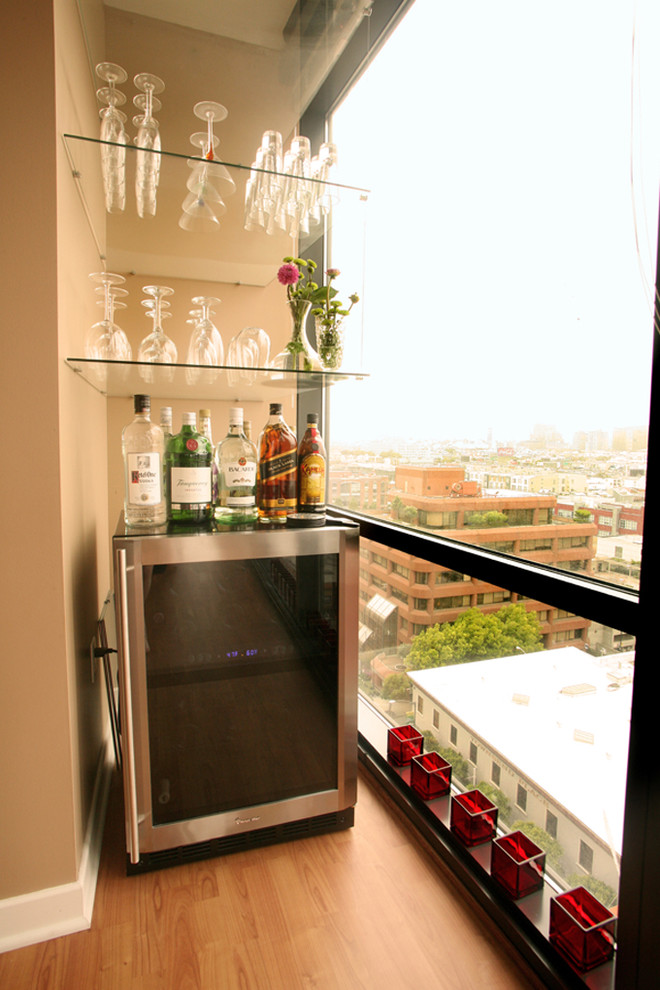 Here is a cool idea – create a home bar on your balcony! A wine cooler could become a mixing station and several shelves could hold all those glasses