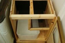 a hidden litter box with a de-littering cat walk is a simple and practical idea that will be appreciated by your cats