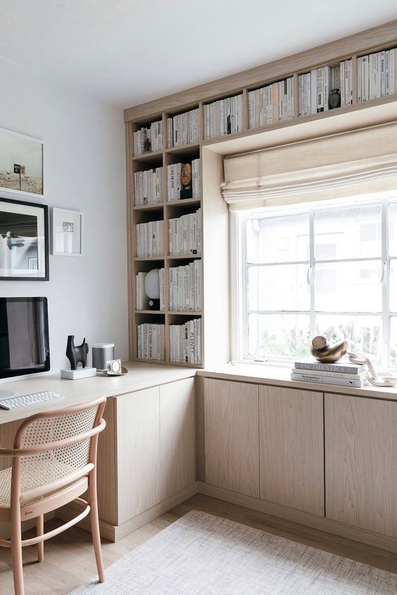 a light-colored plywood bookshelf unit with much closed storage spaces is a modern and fresh idea for a home office