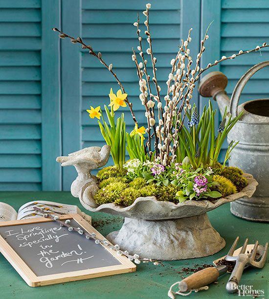 a lovely spring centerpiece of a vintage bowl with daffodils, hyacinths, willow, moss is amazing