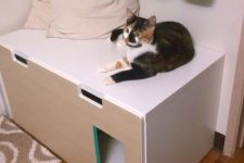 a minimalist IKEA cabinet renovated for your cat – a cat toilet inside and a comfy entrance