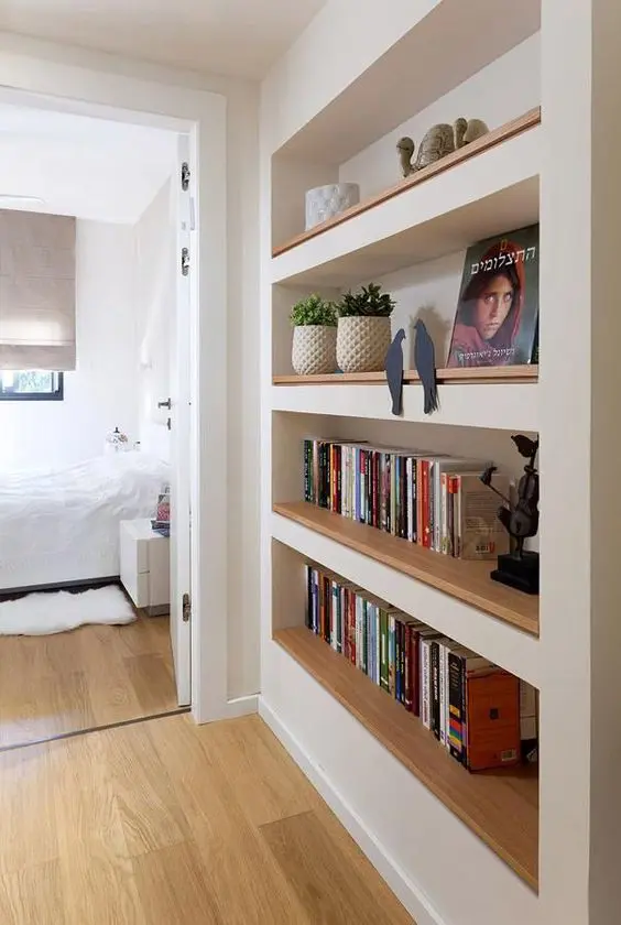 A passway with built in bookshelves will save a lot of your space and keep all your books in order
