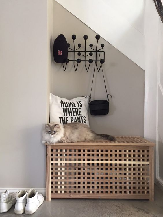 a simple cat litter box cover made of an IKEA Hol table or bench can be placed in your entryway