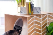 a stenciled cat litter box cover can double as a simple side table or an additional cat bed
