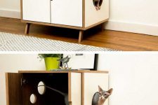 a stylish mid-century modern cabinet on legs, with an entrance, some windows and a bright cat litter box inside