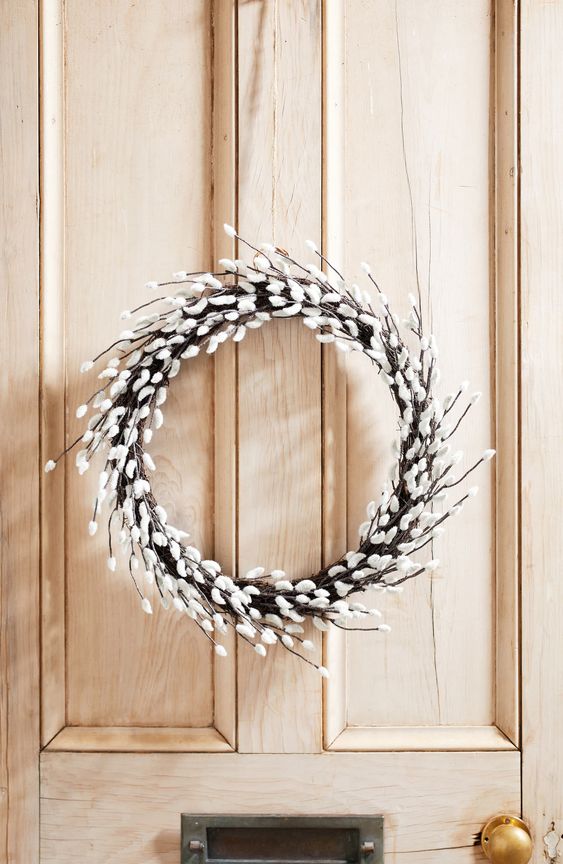 a willow wreath is an ideal front door decoration to mark your home for spring or Easter