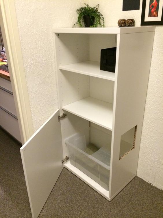an IKEA hack - a Besta unit with a cat litter box inside and a comfortable entrance is cool and easy