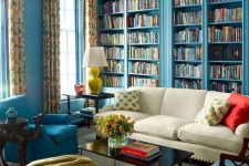 blue built-in bookshelves for designing a whole library in your living room