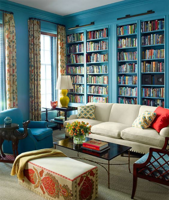Blue built in bookshelves for designing a whole library in your living room