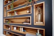 bookshelves and niches built into a wall contrast it and make the use of this blank wall