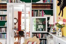 built-in bookshelves over the doorway are a nice way to decorate and use the wall and are amazing