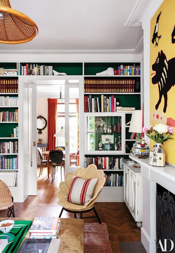 built-in bookshelves over the doorway are a nice way to decorate and use the wall and are amazing