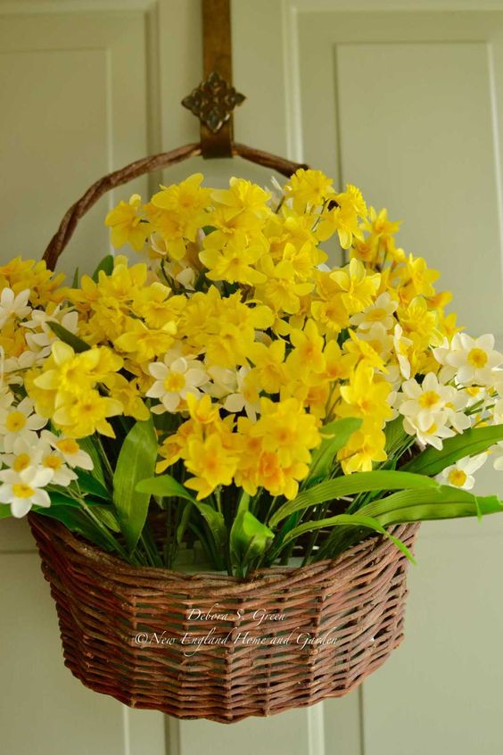 decorate your door with a basket with daffodils and it will be a nice decoration to substitute a wreath