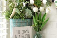 greenery in a bottle, a bucket with greenery and veggies and a moss bunny for a spring or Easter look