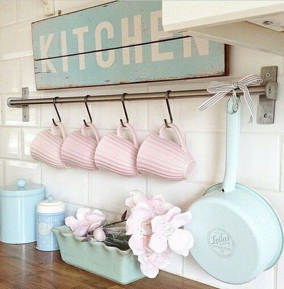 pink mugs, blue tableware and a blue sign will make your space pastel, sweet and spring-infused