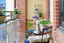 potted greenery and blooms and some usual garden chairs with cushions are nice for a spring outdoor space