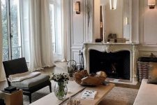 a French style living room done in neutrals – off-white, ocher, light greys and jsut some touches of dark shades