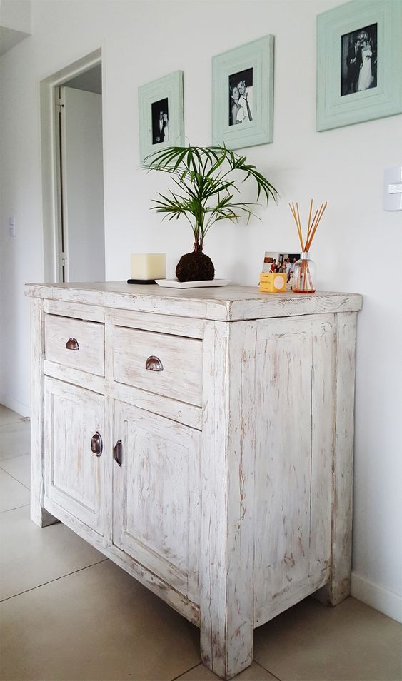 a delicate whitewashed credenza is a lovely idea not only for a vintage or farmhouse space but also for many others, too