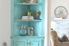 a turquoise shabby chic corner storage unit with open shelves and doors is a stylish touch of color and a cool use of a small corner