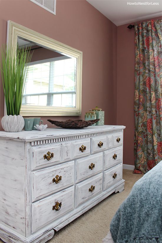 a vintage whitewashed dresser with elegant gold knobs is a very chic and stylish idea for a bright bedroom
