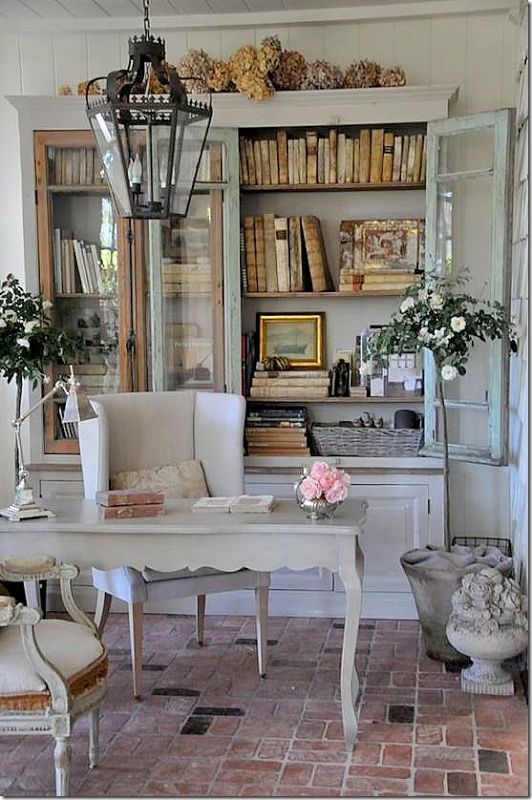 an oversized whitewashed bookcase with glass doors is a fantastic idea for a refined shabby chic home office