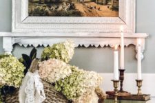 a basket with neutral hydrangeas and lace bows is a cool rustic decoration for any indoor or outdoor space