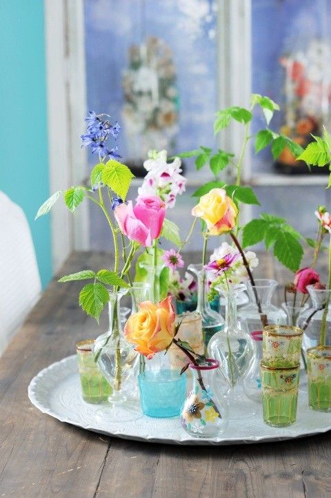 a vintage tray with elegant vases and glasses and bright blooms is a lovely summer decoration for any home