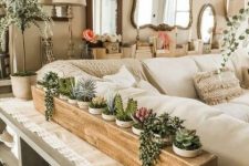 a wooden stand with plenty of planters and succulents of various kinds is a stylish idea for a console table