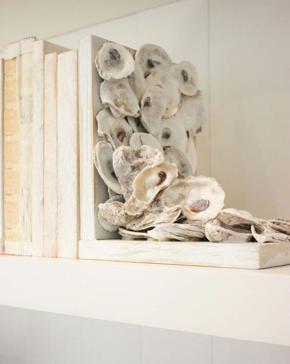 an oyster shellbookend is a cool idea to highlight your beachy decor and you can easily DIY it