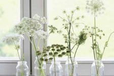 bottles with white blooms will beautifully line up the windowsill or some other space