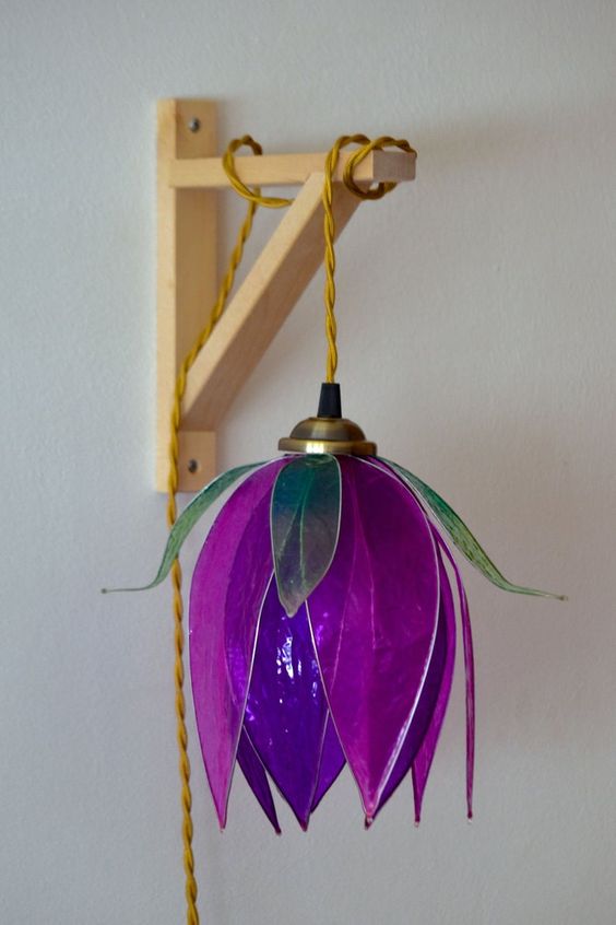 a bright purple flower-shaped pendant lamp will bring much color and a strong natural feel to your space