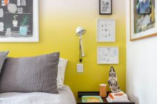 a lovely bedroom with a yellow ombre wall