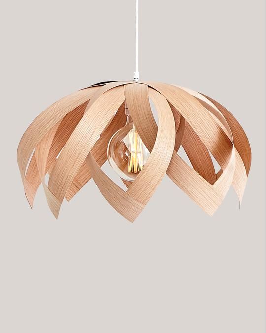 a chic and simple plywood flower pendant lamp is a very creative piece to rock in a modern interior