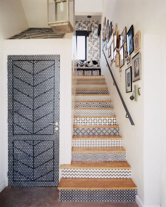 a creative beachy staircase with risers clad with blue patterned tiles is a lovely idea for a seaside home